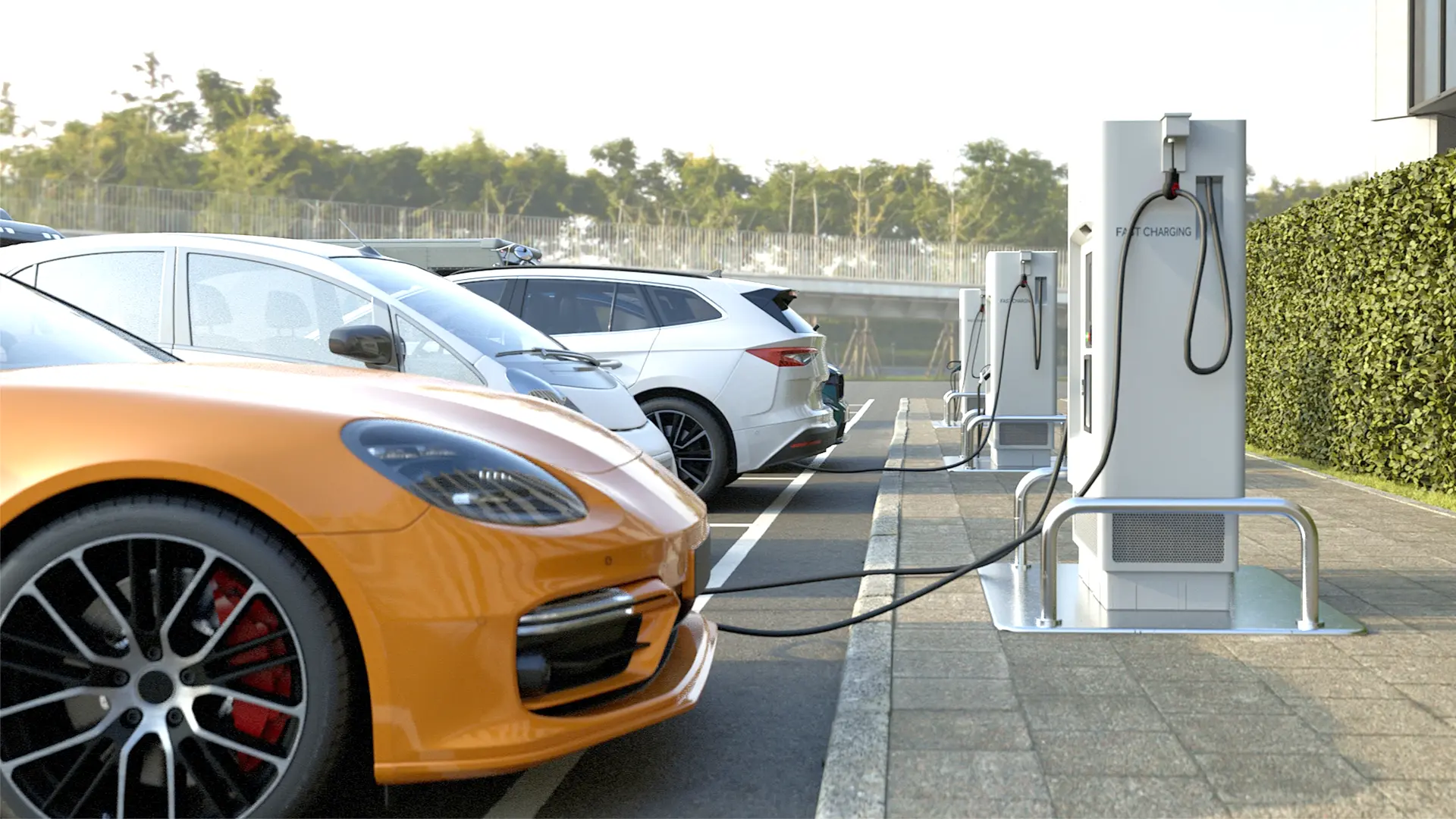 Mobil listrik sedang isi daya di stasiun pengisian dengan latar gedung
